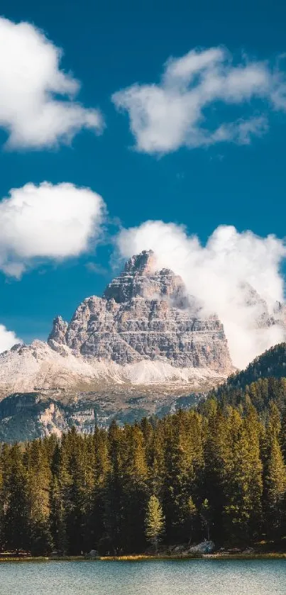 Majestic mountain and serene lake with blue sky and lush forests.