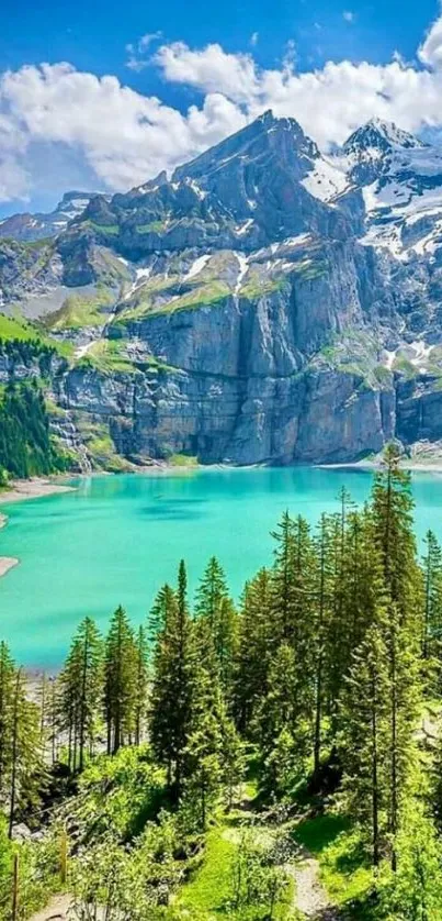 Serene mountain lake with turquoise waters and lush greenery under a blue sky.