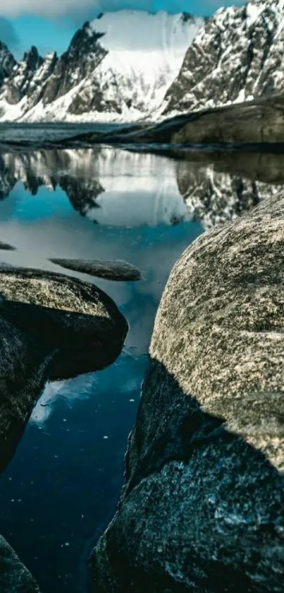 Scenic view of snow-capped mountains reflecting in a tranquil lake.