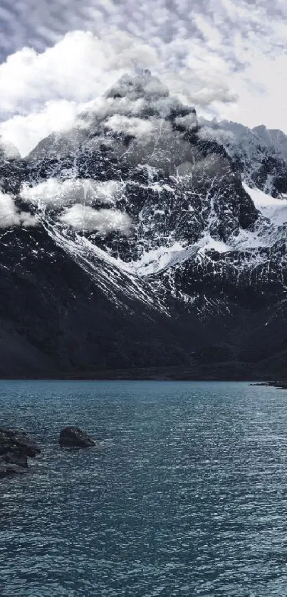 Snowy mountains with a tranquil lake view, perfect for nature wallpapers.