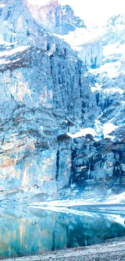 Majestic mountains with serene lake and snow.