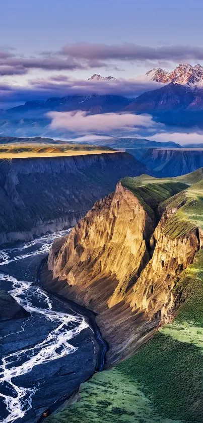 Majestic mountains with green valleys and a winding river.