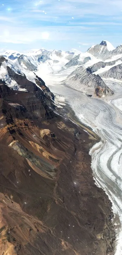 A stunning view of mountains with glaciers under a clear blue sky.