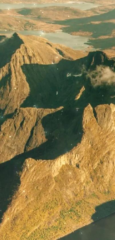 Golden mountain peaks under sunlight, natural scenery.