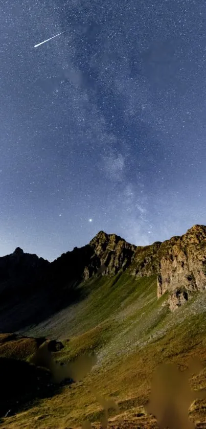 Mountain landscape at night with starry sky and shooting star.