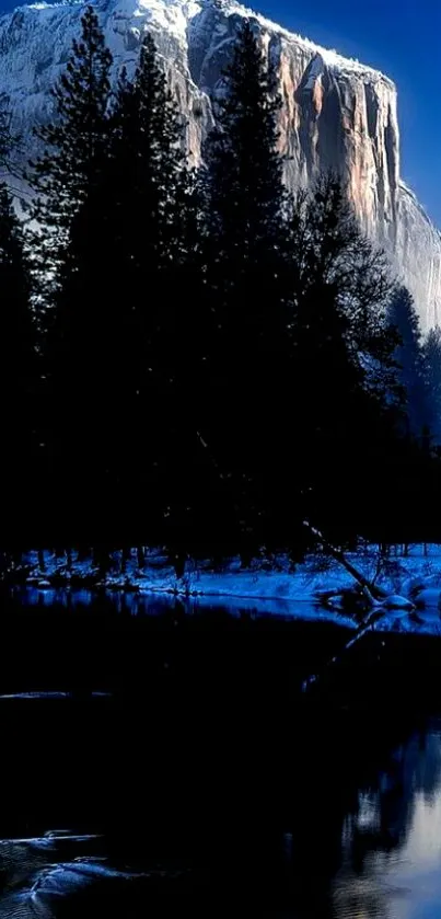 Majestic mountain at night with reflection on water.