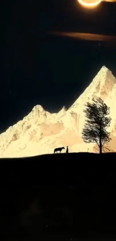 Silhouette of a tree and mountain at night with a starlit sky.