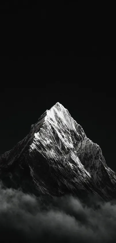 Monochrome mountain peak in misty setting