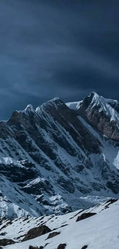 Snowy mountain peaks under a deep blue sky wallpaper.