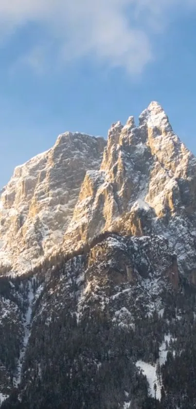 Breathtaking mountain peaks with snow against a clear blue sky.