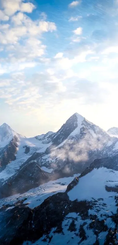 Surreal mountain scene with snow peaks and blue sky.