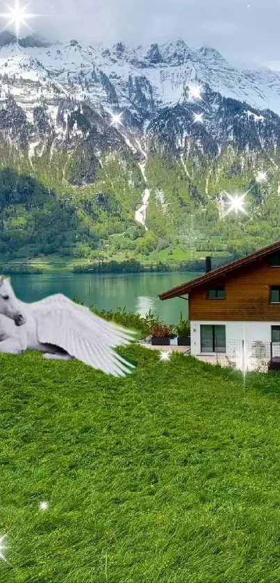 White pegasus on green field with snowy mountains in the background.