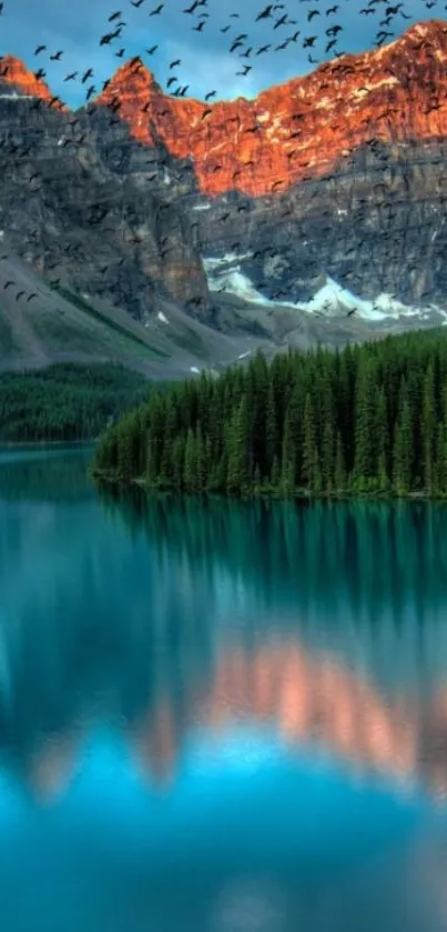 Majestic mountain and lake scene with sunset reflection.