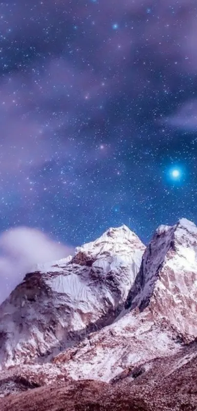 Snow-capped mountains under a starry night sky with a purple hue.