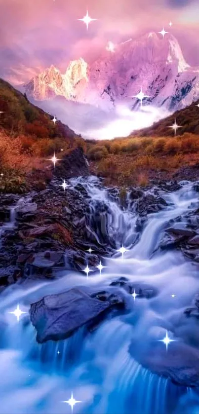 Pink sunset over mountains with stream flowing in foreground.