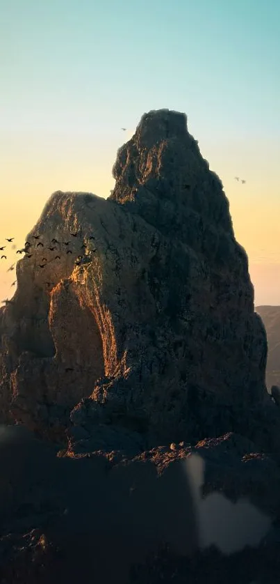 Majestic sunrise over a mountain peak with birds flying in a serene landscape.