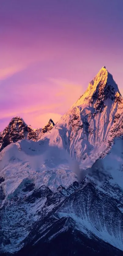 Majestic mountain at sunset with vibrant purple sky.