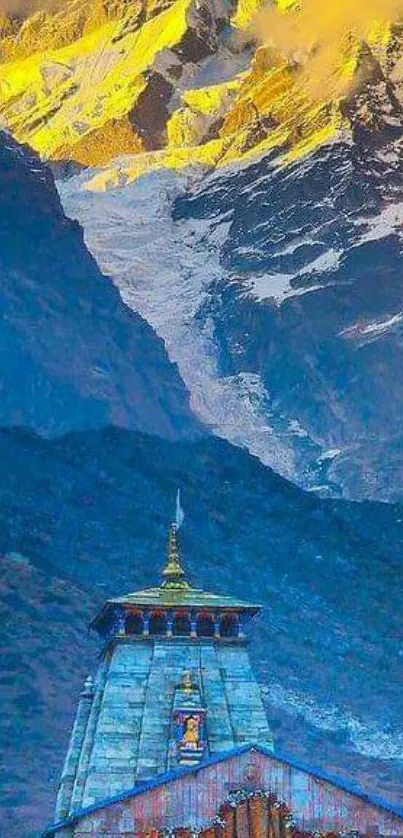 Temple at sunrise with snowy mountains towering behind.