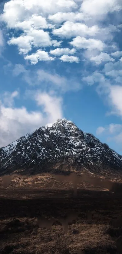 Snow-capped mountain under vibrant blue sky.