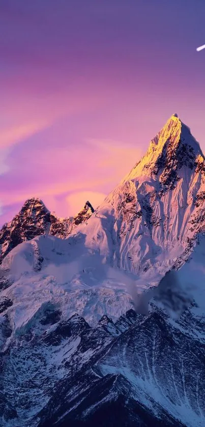 A sunset view of a snow-capped mountain with a purple sky and a shooting star.