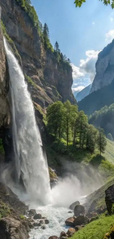 Mountain waterfall cascading into a lush green valley with clear blue skies.
