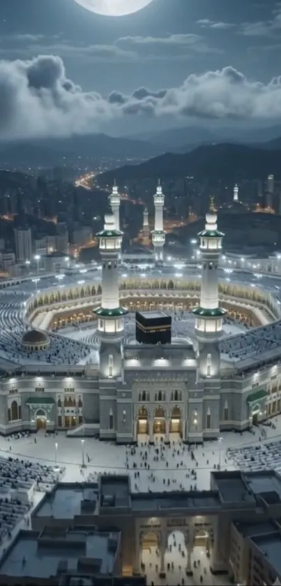 Aerial night view of illuminated mosque and city.