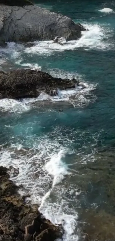 Rocky cliffs and turquoise shoreline with waves crashing gently.