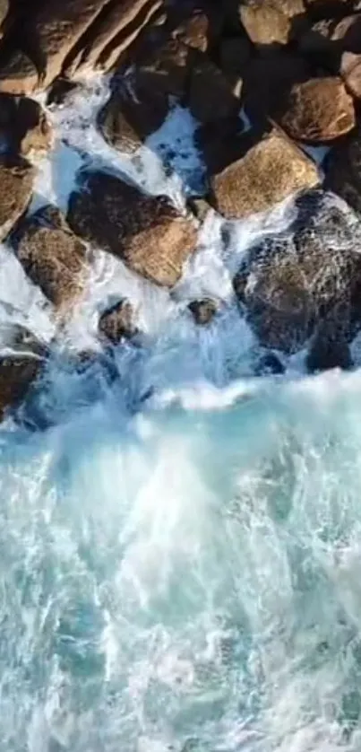 Aerial view of ocean waves crashing on rocky shores.