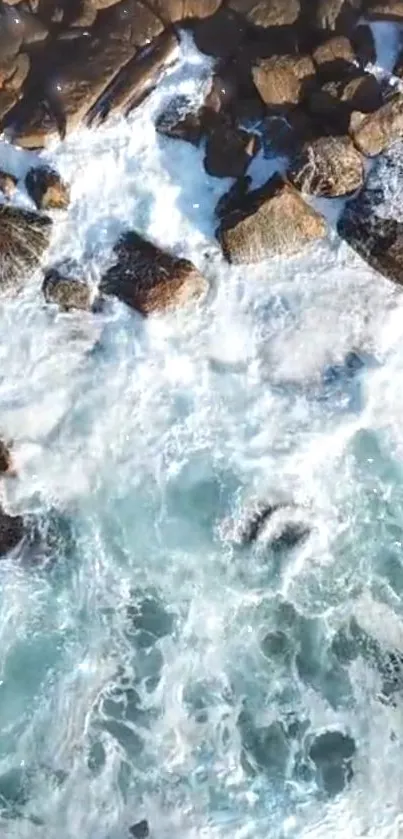 Aerial view of ocean waves crashing against rocky coastlines.