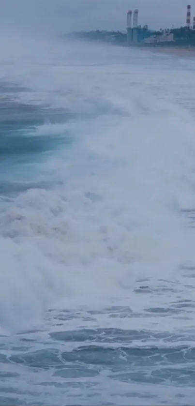 Powerful ocean waves crash on a serene beach.