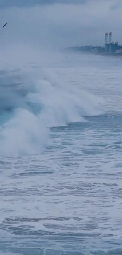 Majestic ocean waves with misty sky and distant coastline.