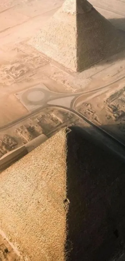 Aerial view of pyramids in Egyptian desert landscape.