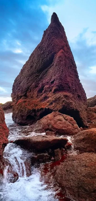 Reddish-brown rock formation under blue sky.