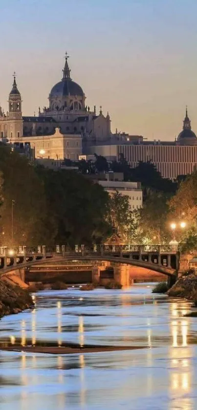 Majestic cityscape at sunset with river reflections and historic architecture.