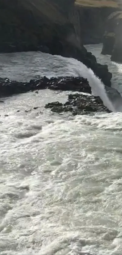 Scenic waterfall cascading through rocky landscape.