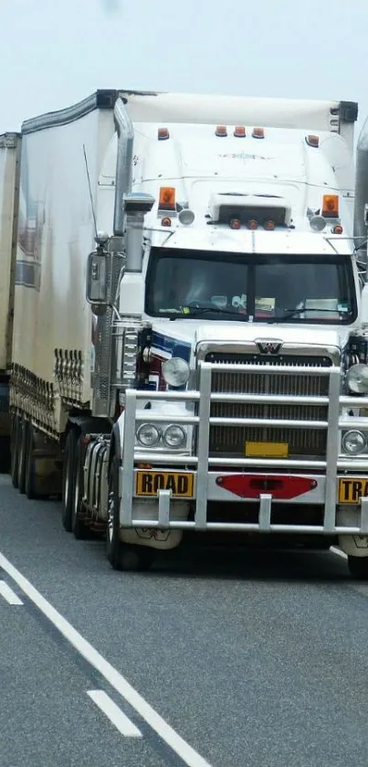 Powerful road train on scenic highway landscape.