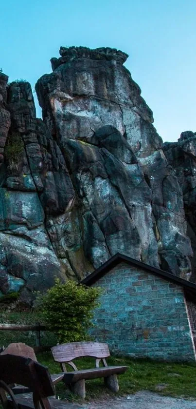 Rocky landscape with benches under a twilight sky.