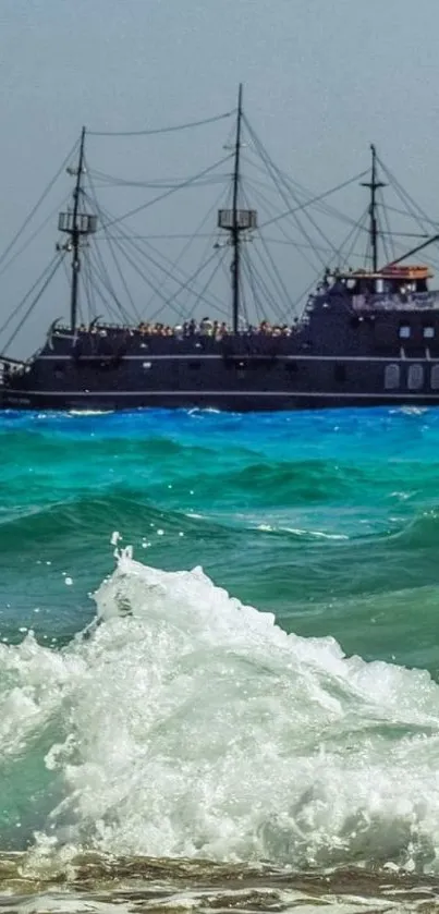 Wallpaper featuring a vintage ship on vibrant blue waves with a clear sky.