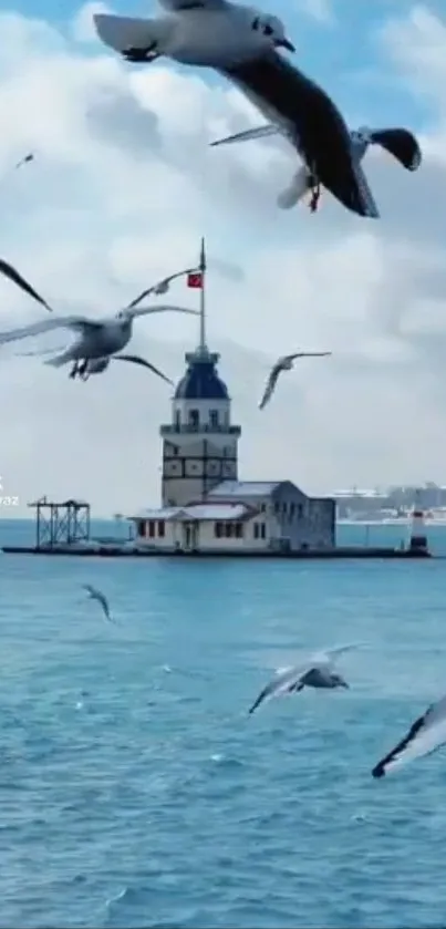 Seagulls soar over a serene sea with an iconic tower in the background.