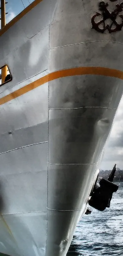 Majestic ship on the ocean with cloudy skies.