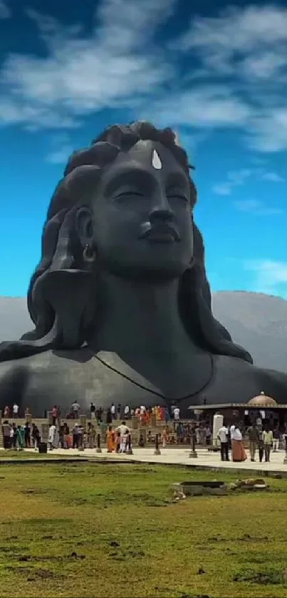 Majestic Shiva statue under blue skies for a scenic wallpaper.