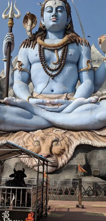 Shiva statue with blue tones and detailed features for mobile wallpaper.