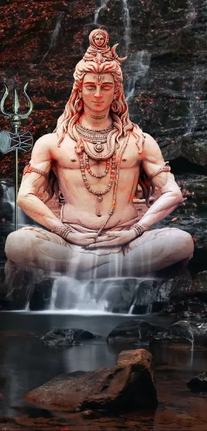 Shiva statue meditation with waterfall backdrop.