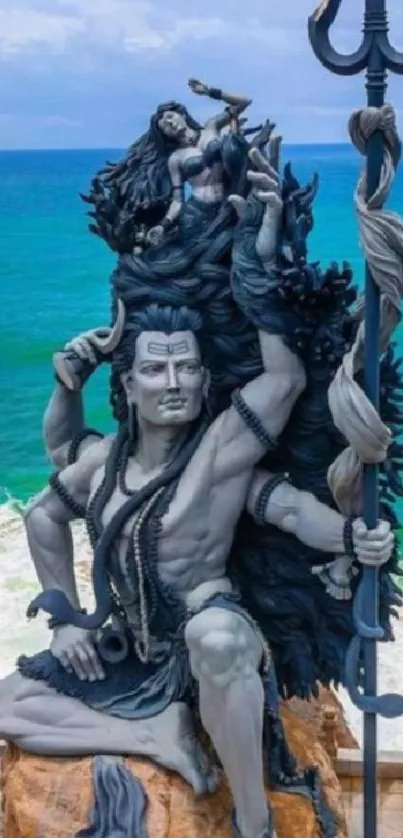 Majestic statue of Shiva overlooking the ocean.