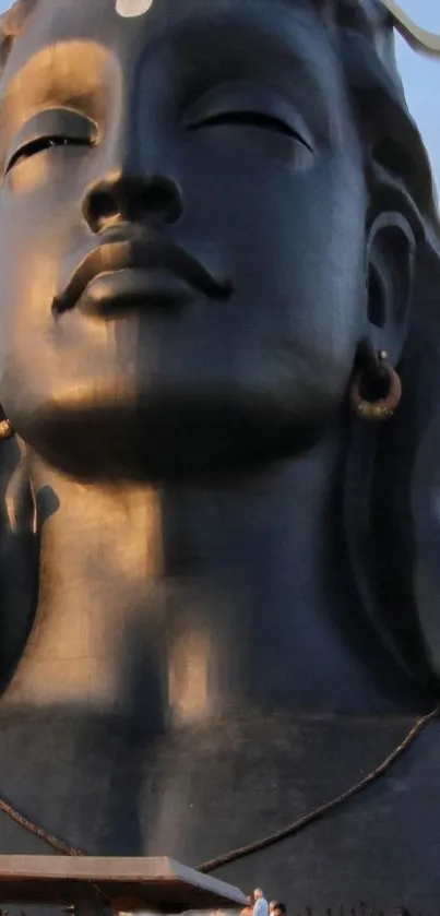 Majestic Shiva statue under a clear sky, radiating peace and spirituality.