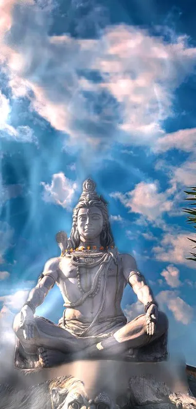 Majestic statue of Shiva under a blue sky with clouds.