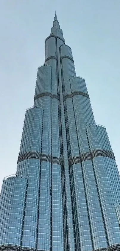 Majestic skyscraper against a clear blue sky.