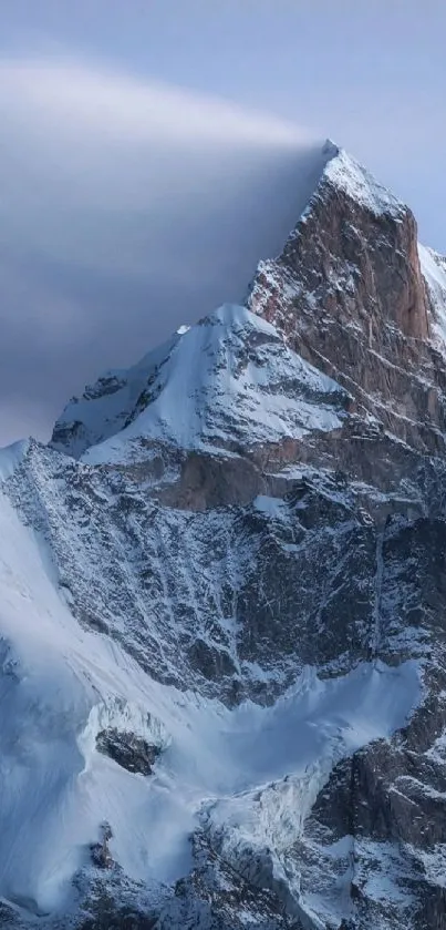 Snow-capped mountain peak under a serene blue sky.