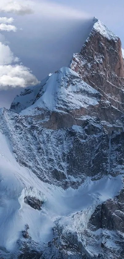 Snowy mountain peak with clear blue sky.