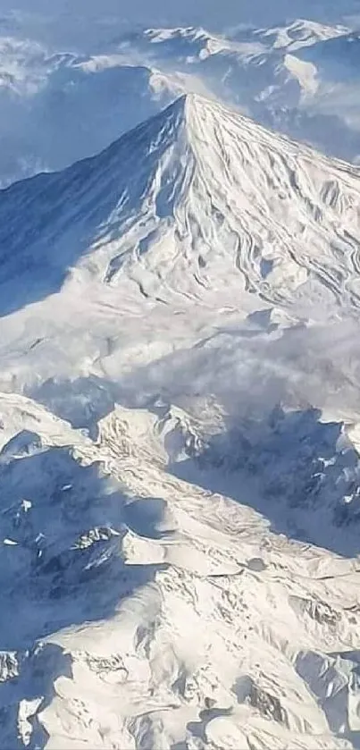 Majestic snow-covered peak with clear blue sky, ideal mobile wallpaper.